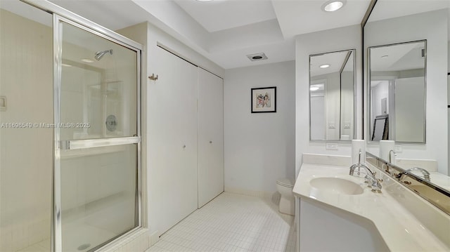 bathroom with vanity, an enclosed shower, and toilet