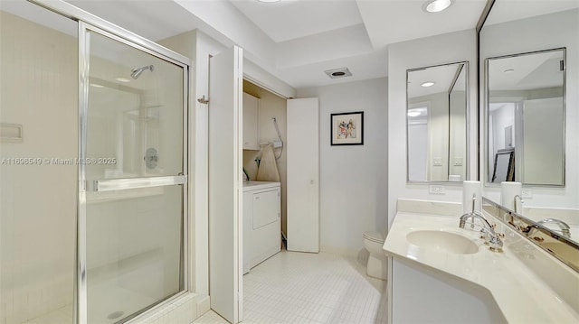 bathroom with vanity, washer / clothes dryer, toilet, and walk in shower