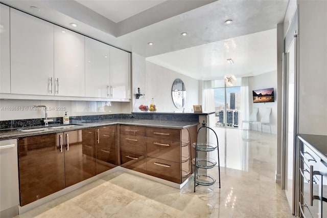 3201 NE 183rd St Unit 2607, Aventura, FL 33160 - kitchen with a sink, modern cabinets, white cabinetry, stainless steel dishwasher, and a peninsula