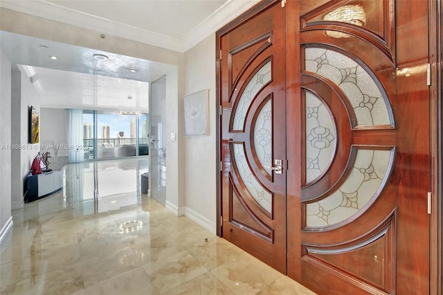 foyer with crown molding and french doors