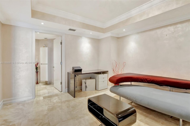 sitting room with a tray ceiling and crown molding