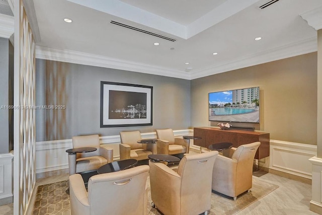 home theater room featuring ornamental molding