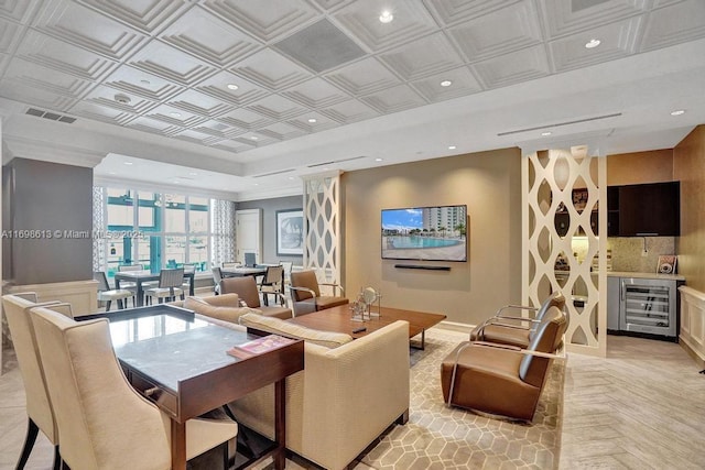 living room featuring wine cooler and light parquet floors