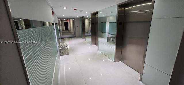 corridor with light tile patterned floors