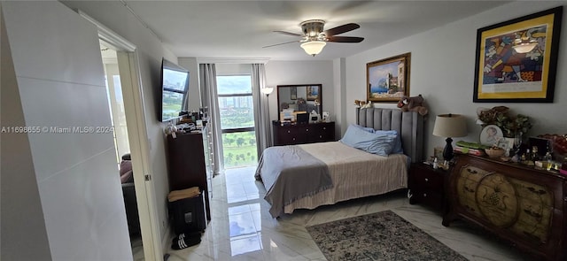 bedroom with access to exterior and ceiling fan