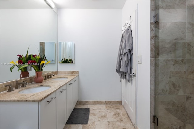 bathroom with vanity and an enclosed shower