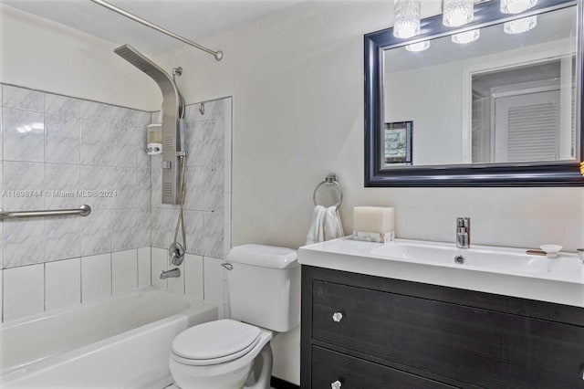 full bathroom featuring vanity, tiled shower / bath combo, and toilet