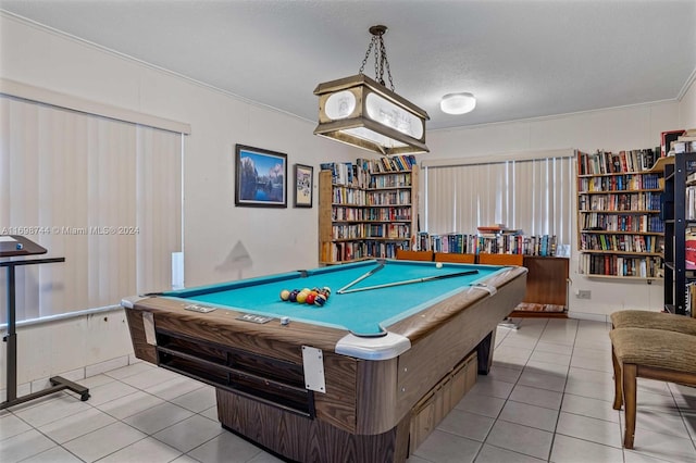 playroom with a textured ceiling, light tile patterned floors, crown molding, and billiards