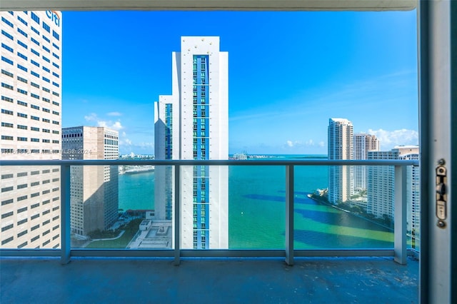 balcony featuring a water view