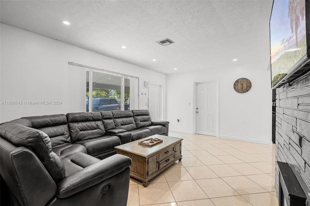 tiled living room with a textured ceiling