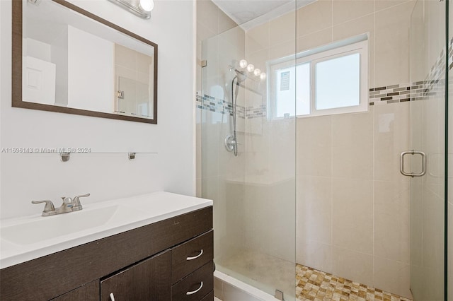 bathroom with vanity and an enclosed shower