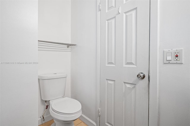 bathroom featuring tile patterned floors and toilet