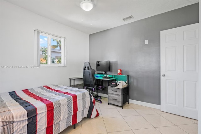 bedroom with light tile patterned flooring