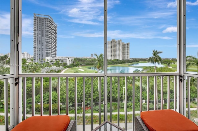 balcony featuring a water view