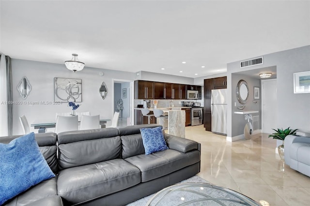 living room with light tile patterned flooring