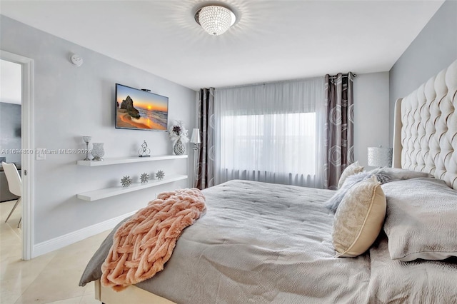 bedroom featuring light tile patterned flooring