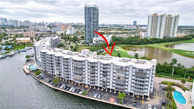 birds eye view of property with a water view