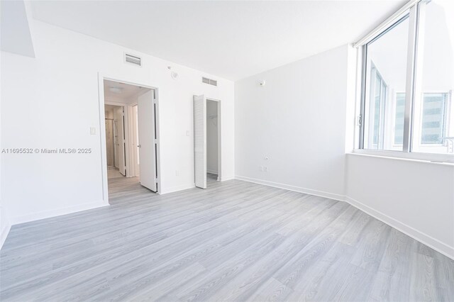 full bathroom featuring vanity, tile patterned flooring, tiled shower / bath, and toilet