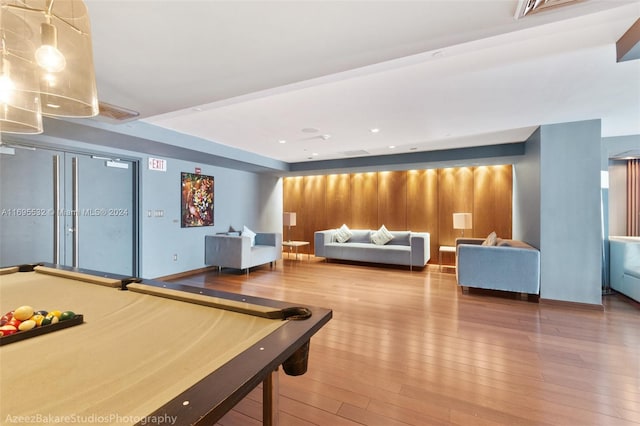 recreation room with hardwood / wood-style floors and pool table