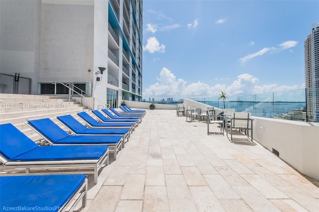 view of patio with a water view