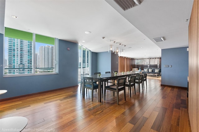 dining room with hardwood / wood-style floors