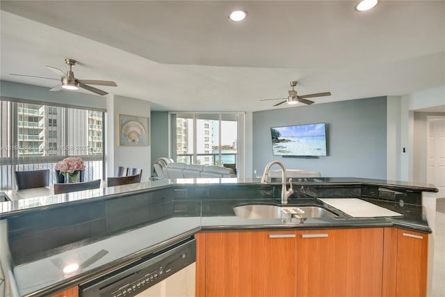 carpeted living room featuring ceiling fan and a textured ceiling