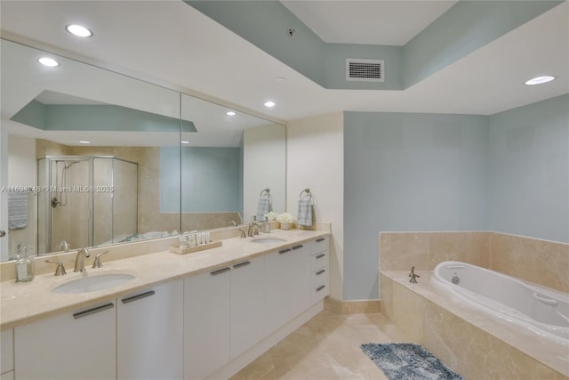 bathroom with tile patterned floors, vanity, and separate shower and tub