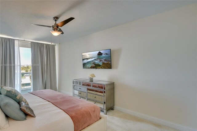 bedroom with light colored carpet and ceiling fan