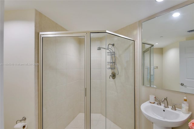 bathroom with sink and walk in shower