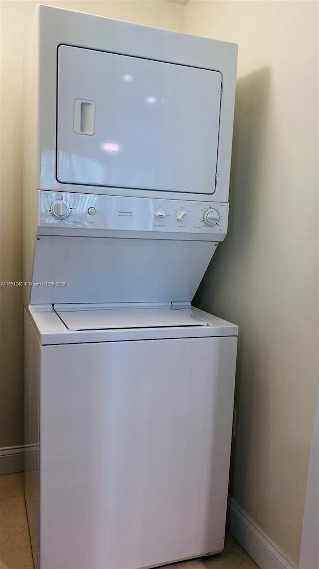 laundry area with stacked washer / dryer