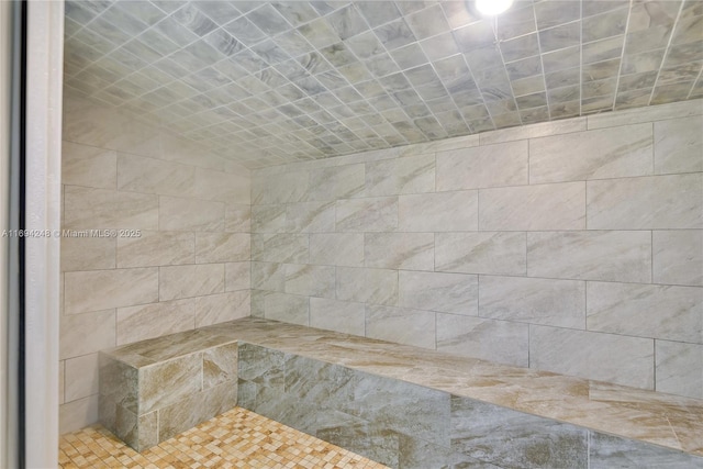 bathroom with a tile shower