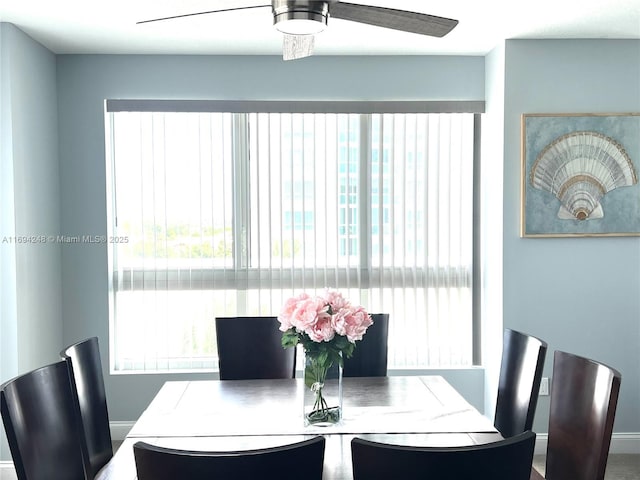 dining space featuring ceiling fan