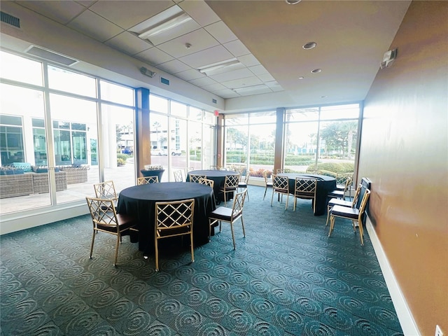 sunroom / solarium with a paneled ceiling