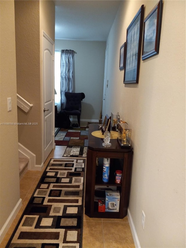 hallway with light tile patterned floors