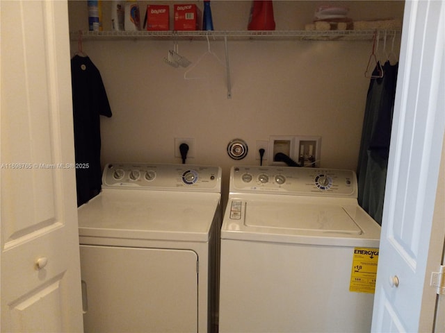 washroom with washer and dryer