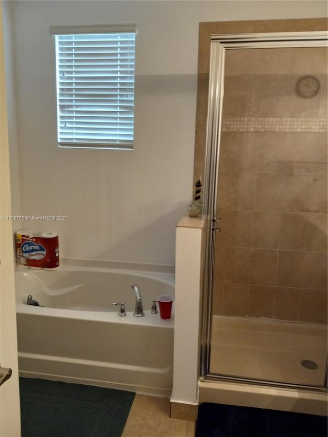 bathroom featuring separate shower and tub and tile patterned flooring