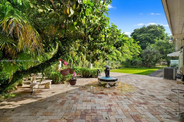 view of patio with central AC unit