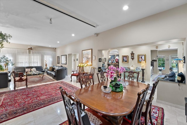 dining area with plenty of natural light and light tile patterned floors