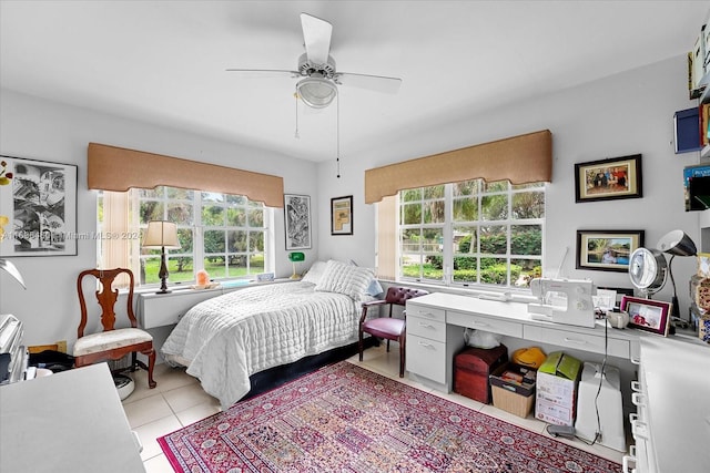 tiled bedroom with multiple windows and ceiling fan