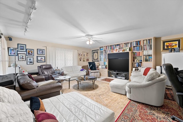 living room with ceiling fan and rail lighting