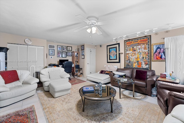 living room with ceiling fan, light tile patterned flooring, and track lighting