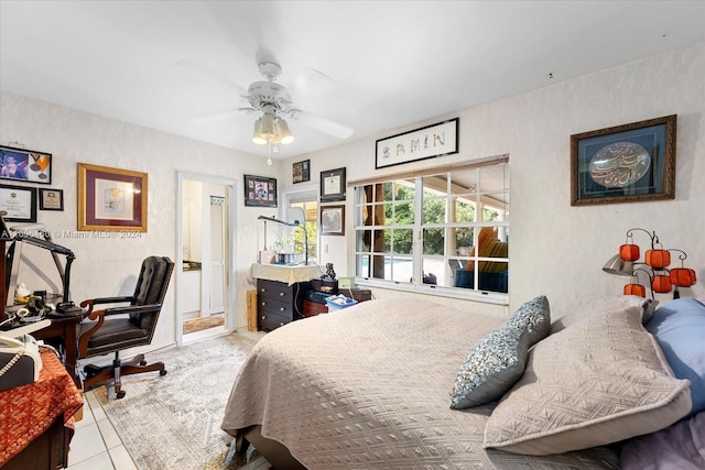 tiled bedroom featuring ceiling fan