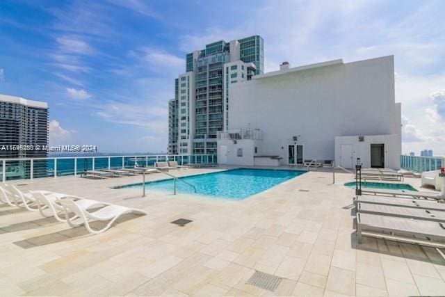 view of swimming pool featuring a patio area