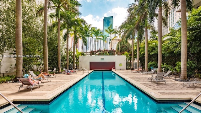 view of pool featuring a patio area