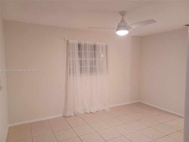 tiled empty room with ceiling fan