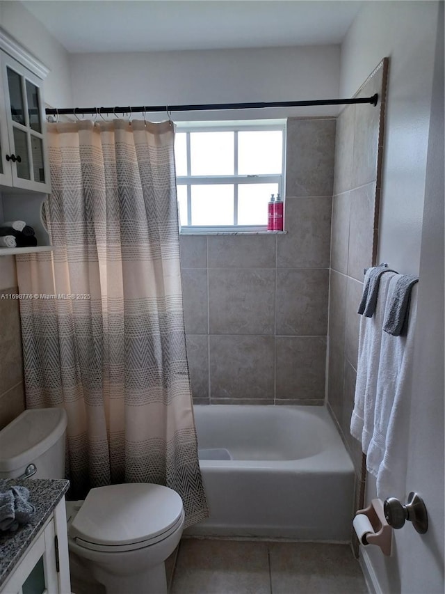 full bathroom featuring tile patterned flooring, vanity, shower / tub combo, and toilet