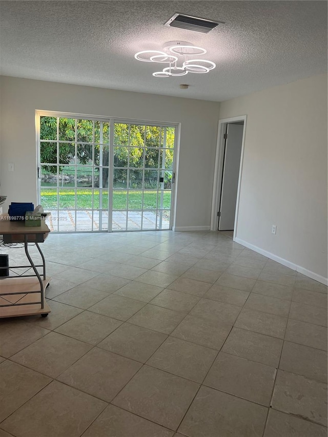 empty room featuring tile patterned floors