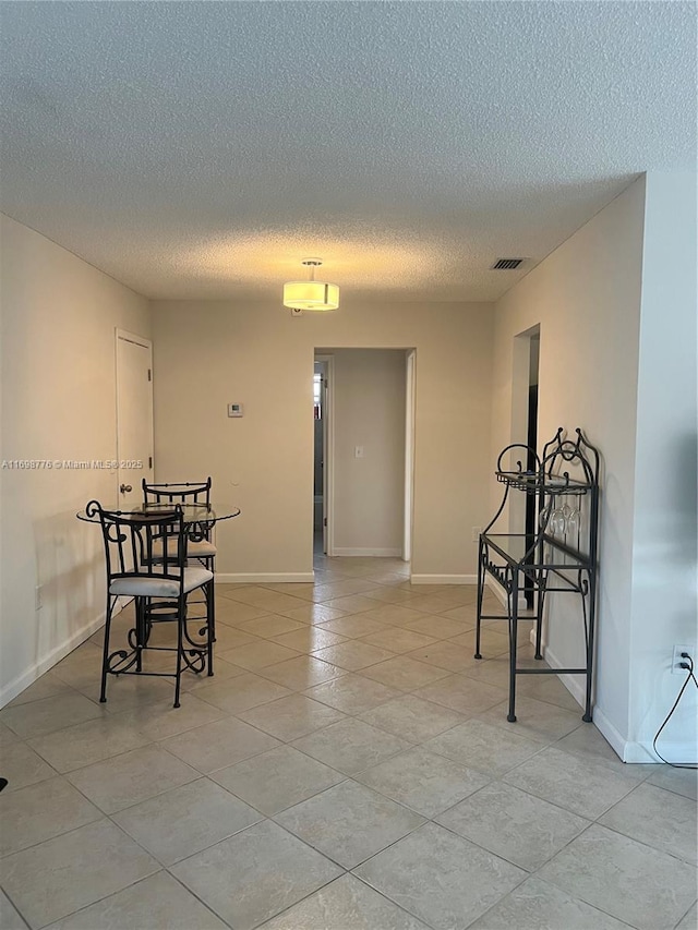 dining space with light tile patterned floors