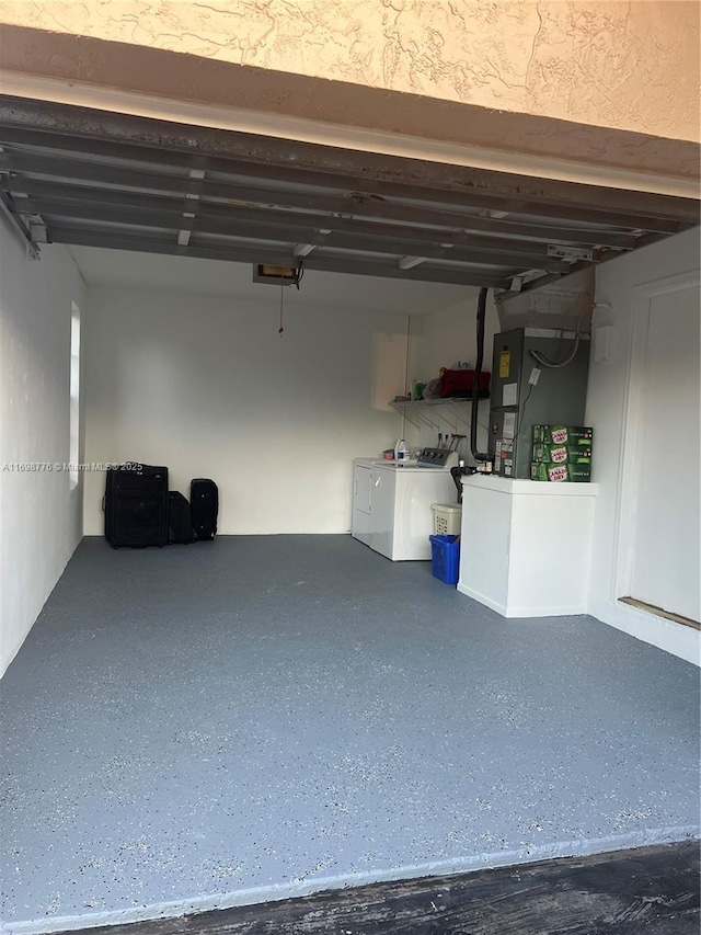 garage featuring washing machine and dryer