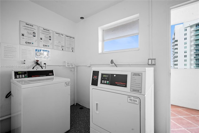 laundry area featuring plenty of natural light and washing machine and dryer